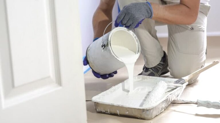 pouring-white-paint-into-a-square-bucket